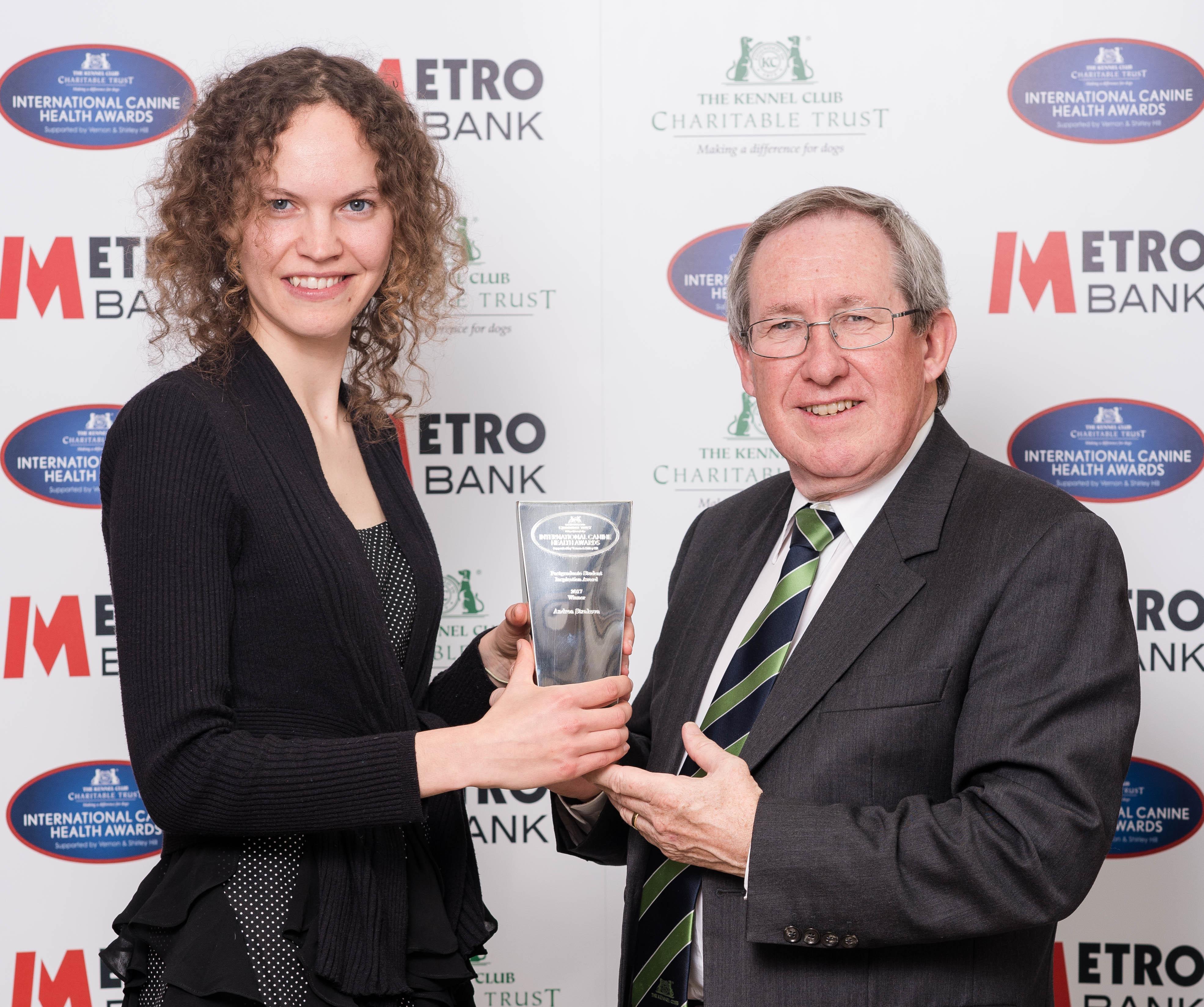 Andy receives her award from Prof Steve Dean. Photocredit: the Kennel Club Cambridge veterinary student wins postgraduate award for her research into oldest canine cancer