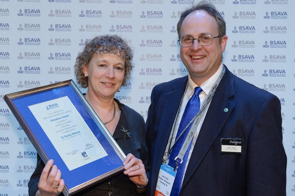 Penny receiving her award from John Chitty, BSAVA President Penny Watson recognised for outstanding contribution to small animal veterinary medicine