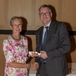 Jackie Brearley receiving her award from Professor Graham Virgo